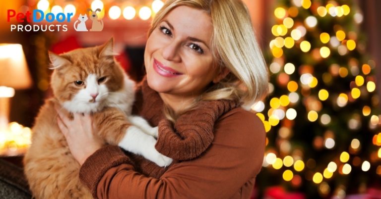 Happy Lady With Cat in Front of a Christmas Tree