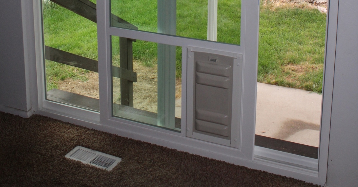 Energy-efficient all-weather pet door in a glass sliding door in Utah