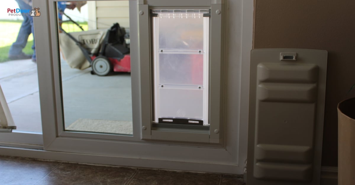 Dog freely using a sliding glass dog door in a Utah home