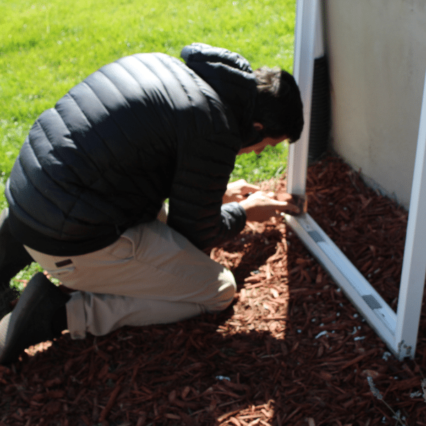 Professional technician installing sliding glass door panel